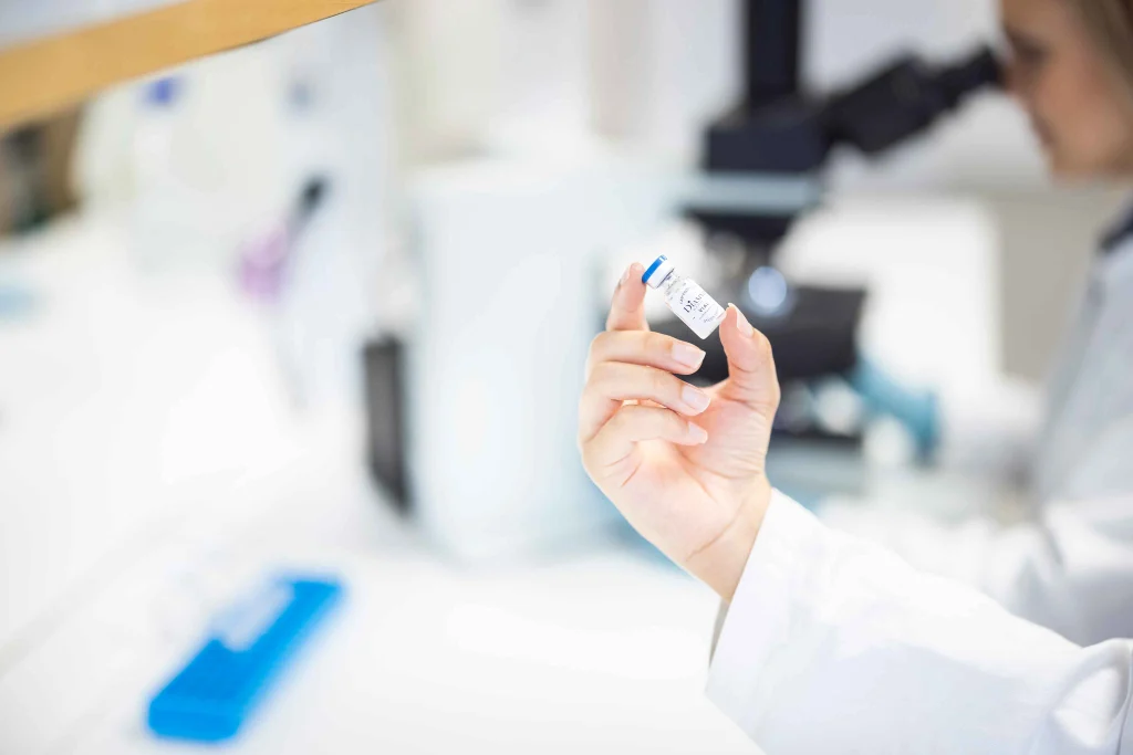 Person inspecting a vial