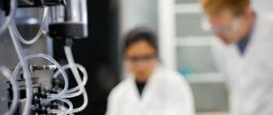 Two NorthX Biologics employees working in a lab.